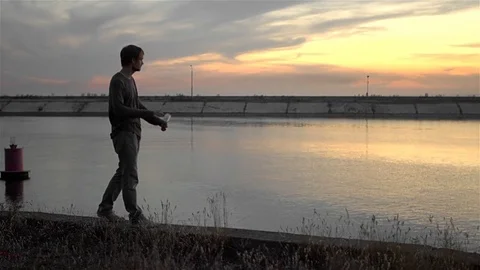 1 guy with bat in hand go. One man hit bat through air. Stock Footage 72643586