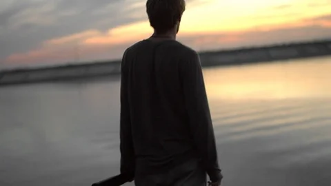 1 guy with bat in hand go. One man hit bat through air. Stock Footage 72643690
