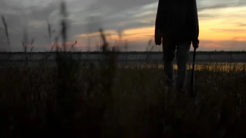 1 guy with bat in hand go. One man hit bat through air. Stock Footage 72643771