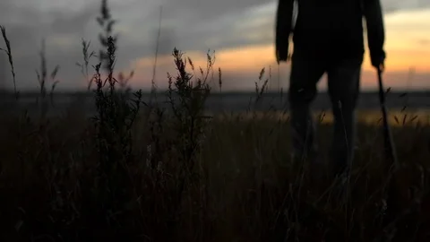 1 guy with bat in hand go. One man hit bat through air. Stock Footage 72643791