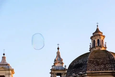 1 large bubble, domes of Catholic churches against the sky in the evening Stock Photos