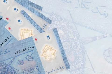 1 Malaysian ringgit bills lies in stack on background of big semi-transparent Stock Photos