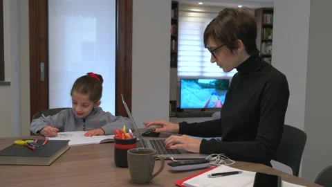 1 Mom Doing Remote Work And Daughter Studying In Kitchen Stock Footage 147095762