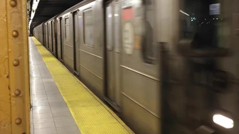 1 one train arriving in a station on the tracks (nyc subway metro commuter rail) Stock Footage 303592044