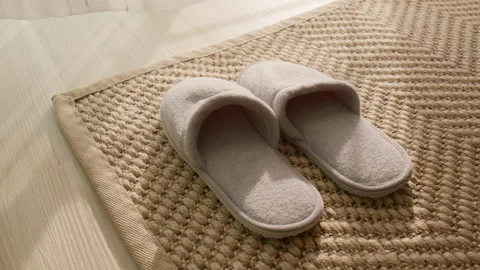 1 pair of shoe place in front of the doorway  in the morning Stock Footage 163488196