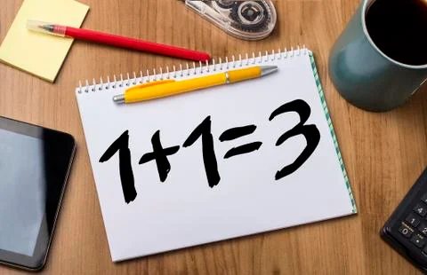 1 plus 1 equal 3 - plus one free - - Note Pad With Text On Wooden Table Stock Photos