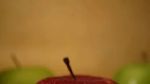 1 Red Apple, 2 Green Apples - Crane Down Stock Footage 22338175