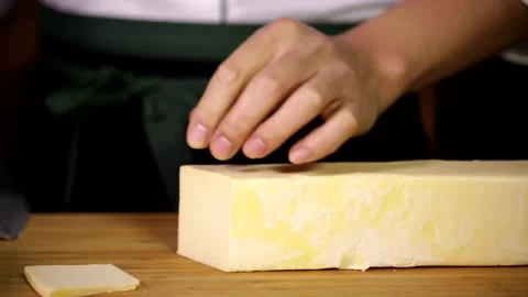 1 Slice the rectangular butter block to make Dim sum Stock Footage 236549633