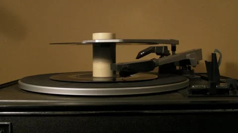 1-Two 45 single record spinning around on 1960s turntable v1 Stock Footage 7730076