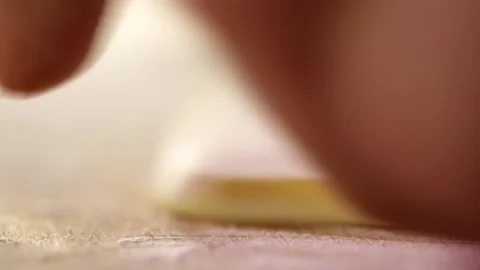 1 Use a rolling pin to thin out the butter slices closeup Stock Footage 236549632