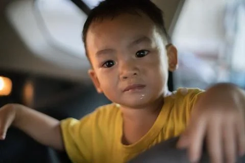 1 Year Old Adorable Asian Boy Playing and Looking Around in the Car Stock Photos