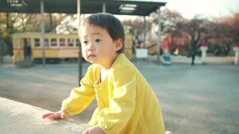 1 year old kid playing outside on holiday Video stock 161858380