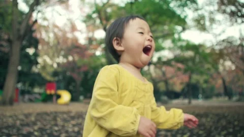 1 year old kid playing outside on holiday Video stock 161858386