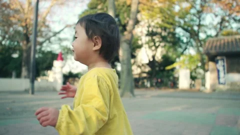 1 year old kid playing outside on holiday Video stock 161858514