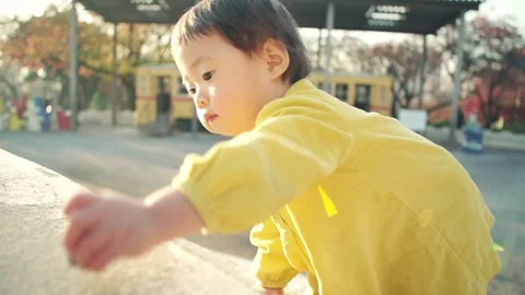 1 year old kid playing outside on holiday Video stock 161858547