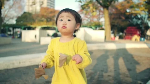 1 year old kid playing outside on holiday Video stock 161858590