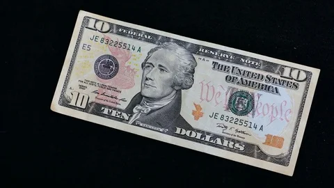 10 dollars on black background Stock Footage 70478466