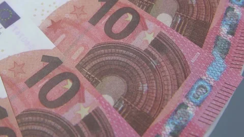 10 euro bills rotating on the table. Rotation of paper money, close-up, FullHD Vídeo Stock 142588807