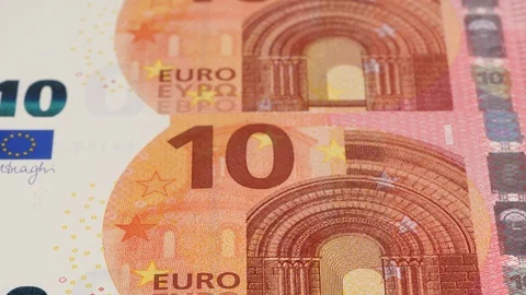 10 Euro notes close up tracking. Euro currency cash. Slider shot, low angle. 4K Stock Footage 125529977