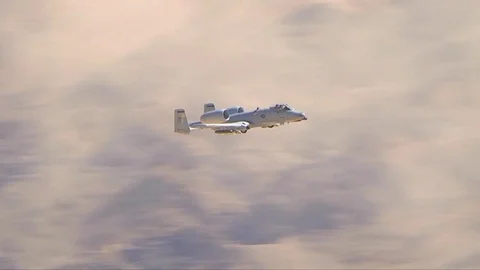 A-10 jet fighter aircraft fire guns and missiles in battle. 库存影片 74797415
