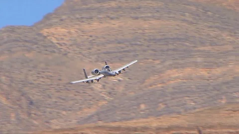 A-10 jet fighter aircraft fire guns and missiles in battle. 库存影片 74797487