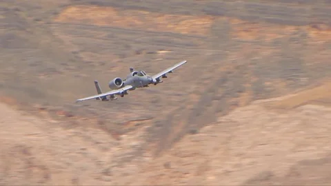 A-10 jet fighter aircraft fire guns and missiles in battle. 库存影片 74807478