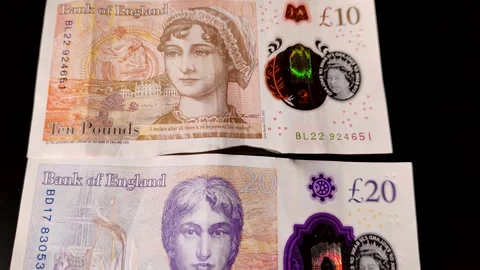 A £10 note, featuring Jane Austen and the £20 note features William Turner Stock Footage 284309232