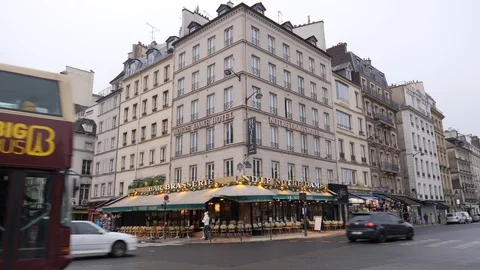 10 Rainy gray winter day Paris street traffic and tour bus goes by Stock Footage 100814538