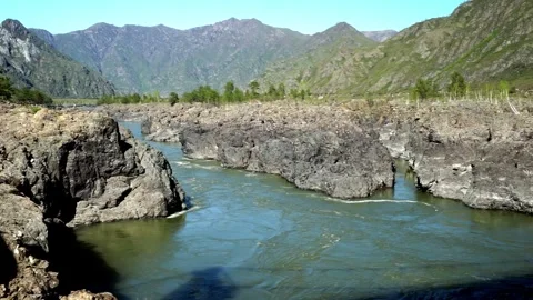 10 river in the mountains, steep and rocky shore, early spring in the mounta Stock Footage 264103787