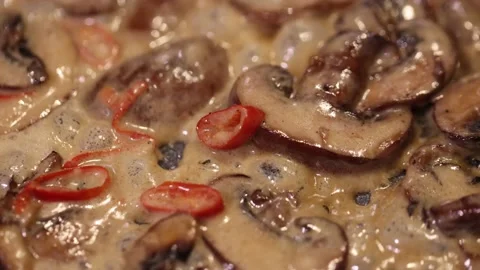 10 second slow motion video of how to bake mushrooms in sauce with chili pepper Stock Footage 165618562