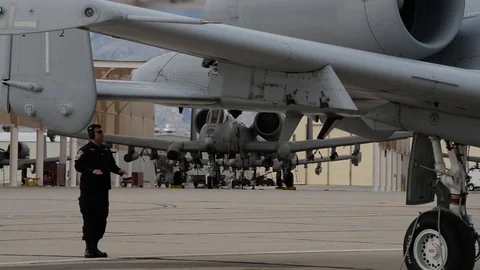 A-10 Thunderbolt demo team marshaller signalling to pilot during flap checks Stock-Footage 104600901