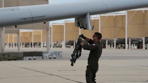 A-10 Thunderbolt II pilot dressing in survival flight vest Stock Footage 104600684