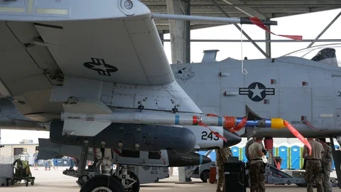A-10 Thunderbolt II 'Warthogs' on static display with various bombs and missiles Stock Footage 111608977
