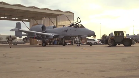 A-10 Thunderbolt Warthog being reversed into hangar 1 Stock Footage 111848823