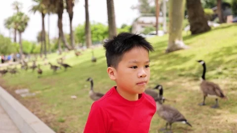 10 Year Old Boy Jogging In a Park in Los Angeles 스톡 동영상 244748791