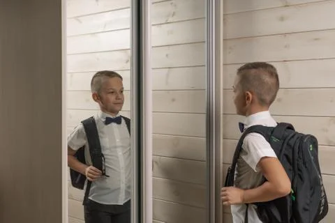 A 10-year-old boy prepares for school after a long summer break. Back to scho Stock Photos