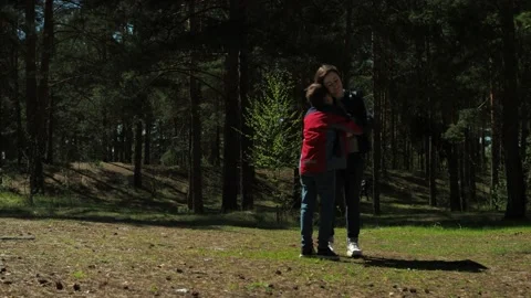 A 10-year-old boy runs towards his mother. hugging a mother with a child in Stock Footage 154368866
