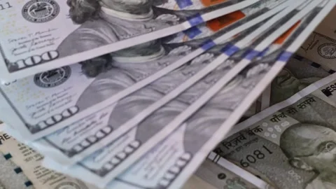 100 american dollar banknotes are placed on top of Indian 500 rupee notes Stock Footage 336663707