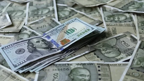 100 american dollars banknotes falling on 500 indian rupees banknotes. Stock Footage 277159775