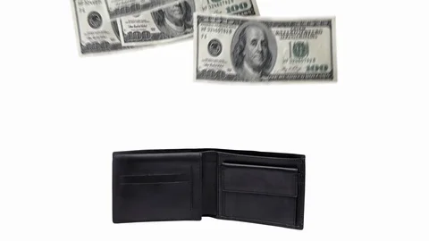 100 american or us dollars rain falling into black leather wallet isolated al Stock Footage 129850384