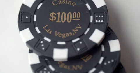 $100 chips dashed across table Stock Footage 112331984