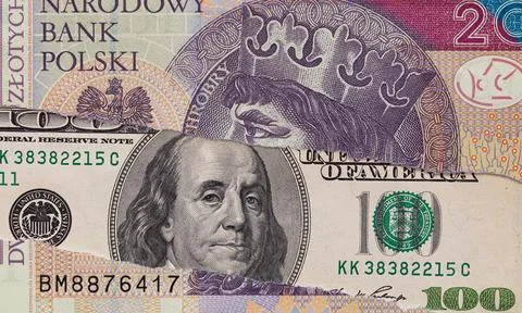 100 dollar banknote through torn 20 Polish zloty banknote Stock Photos