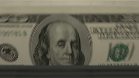 100 Dollar banknotes in cash machine. USD cash counting video.	 Stock Footage 168561013