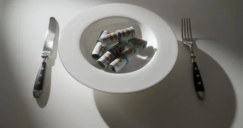 100 Dollar Banknotes on White Plate with Fork and Knife, Wealth Concept Stock Footage 346540583