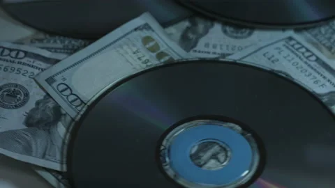 100 Dollar Bills and CDs Slowly Rotate On White Background 4K Video stock 217632567