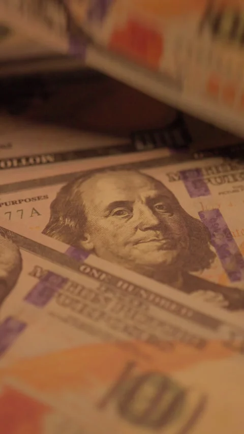 100 dollar bills close-up with Benjamin Franklin 動画素材 345089427