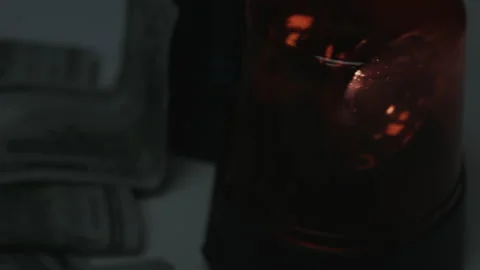 100 Dollar Bills Fall Onto Rotating Police Lights 4K Video stock 217853941