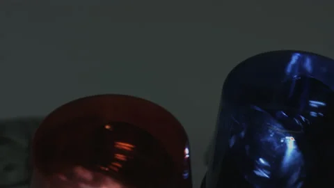 100 Dollar Bills Fall Onto Rotating Police Lights 4K Video stock 217854992