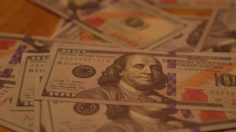 100 dollar bills laid on table close-up 動画素材 345022480