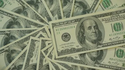 100 dollar bills rotating close up with a slow zoom in Stock Footage